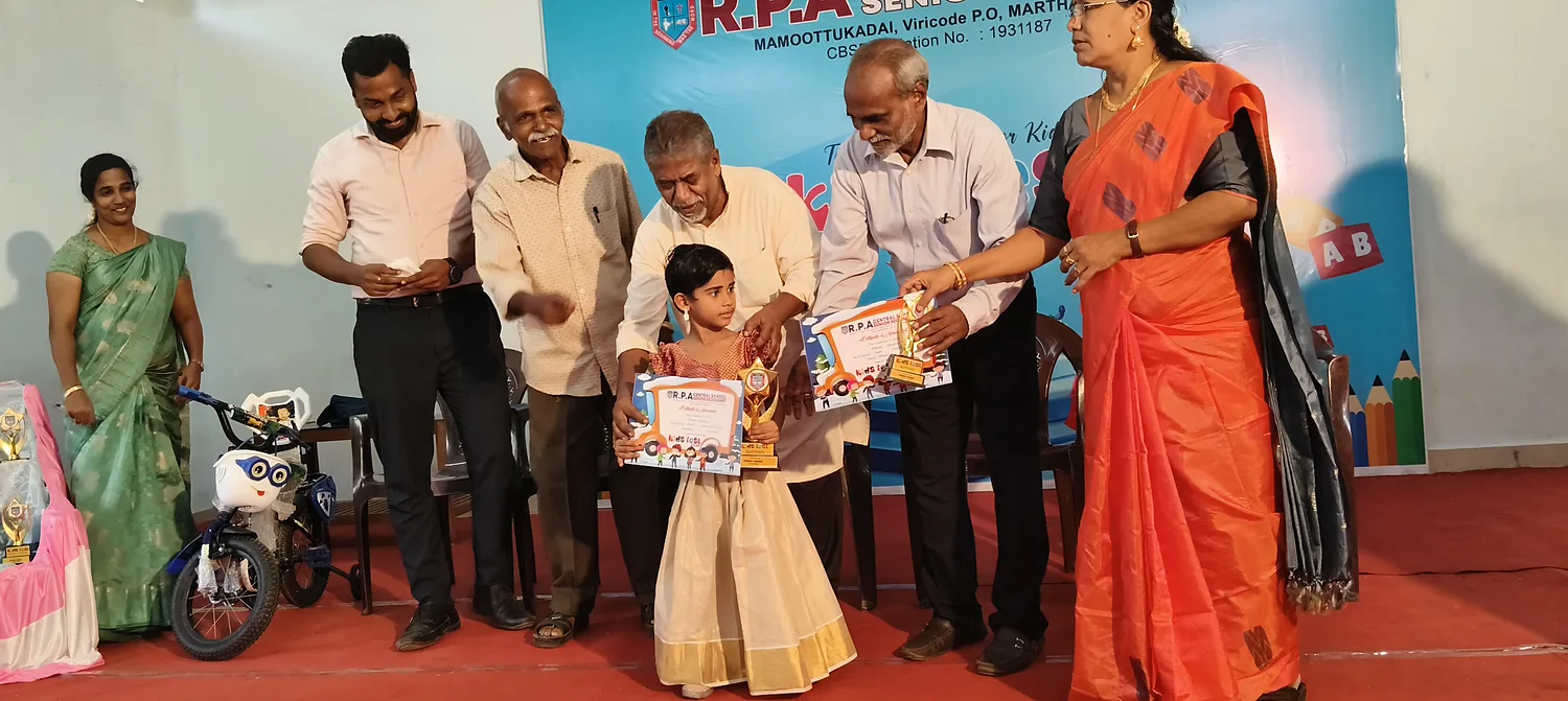 A student receiving an award from dignitaries