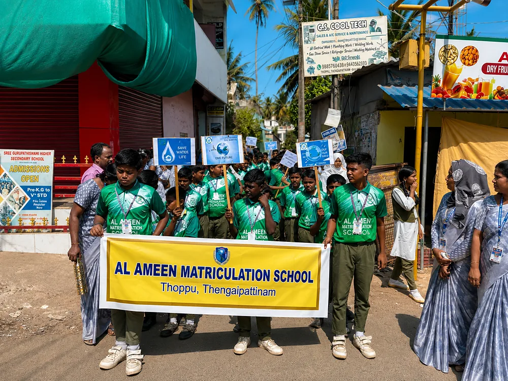 Al-Ameen students participating in a community awareness event