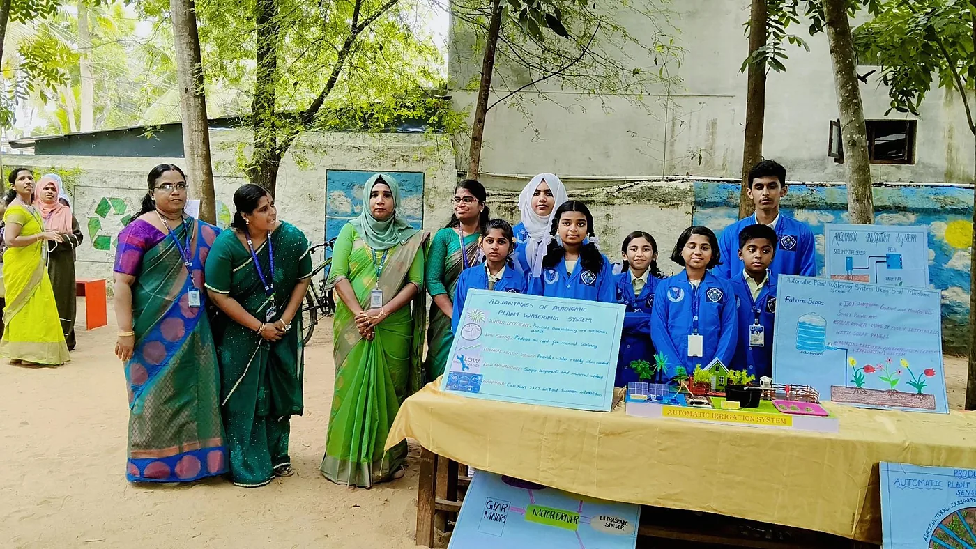 Students displaying science exhibition projects